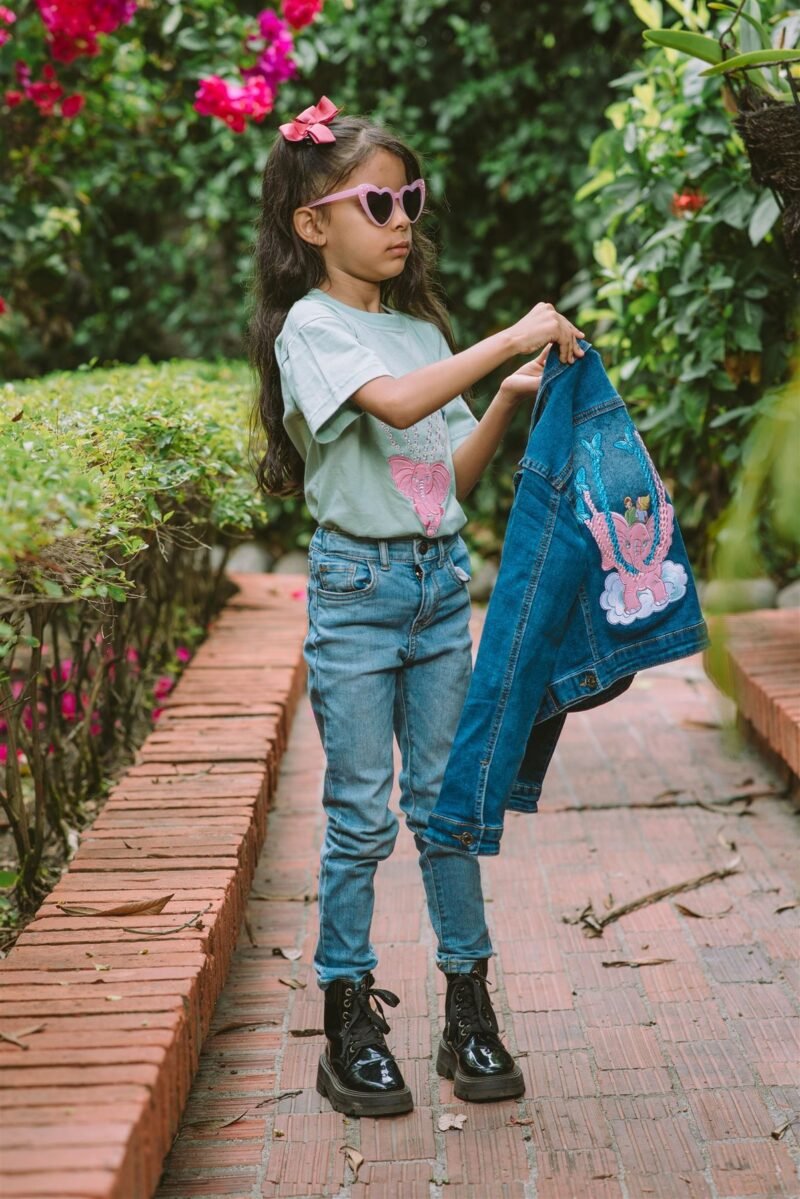 Weightless Pink Elephant Denim Jacket, modeled in the garden